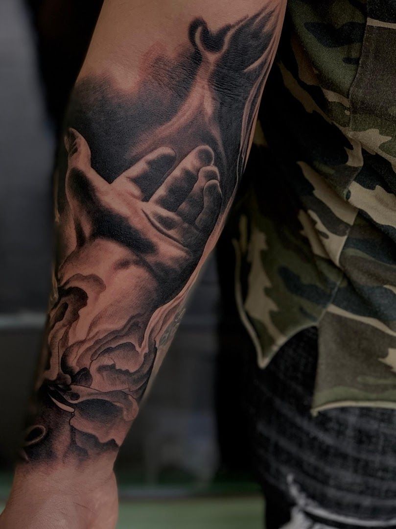 a man with a cover-up tattoo on his arm, darmstadt-dieburg, germany