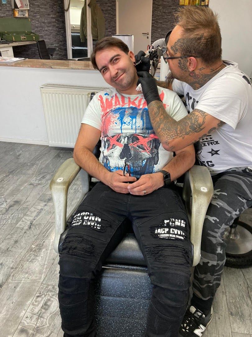 a man getting his hair cut by a barber