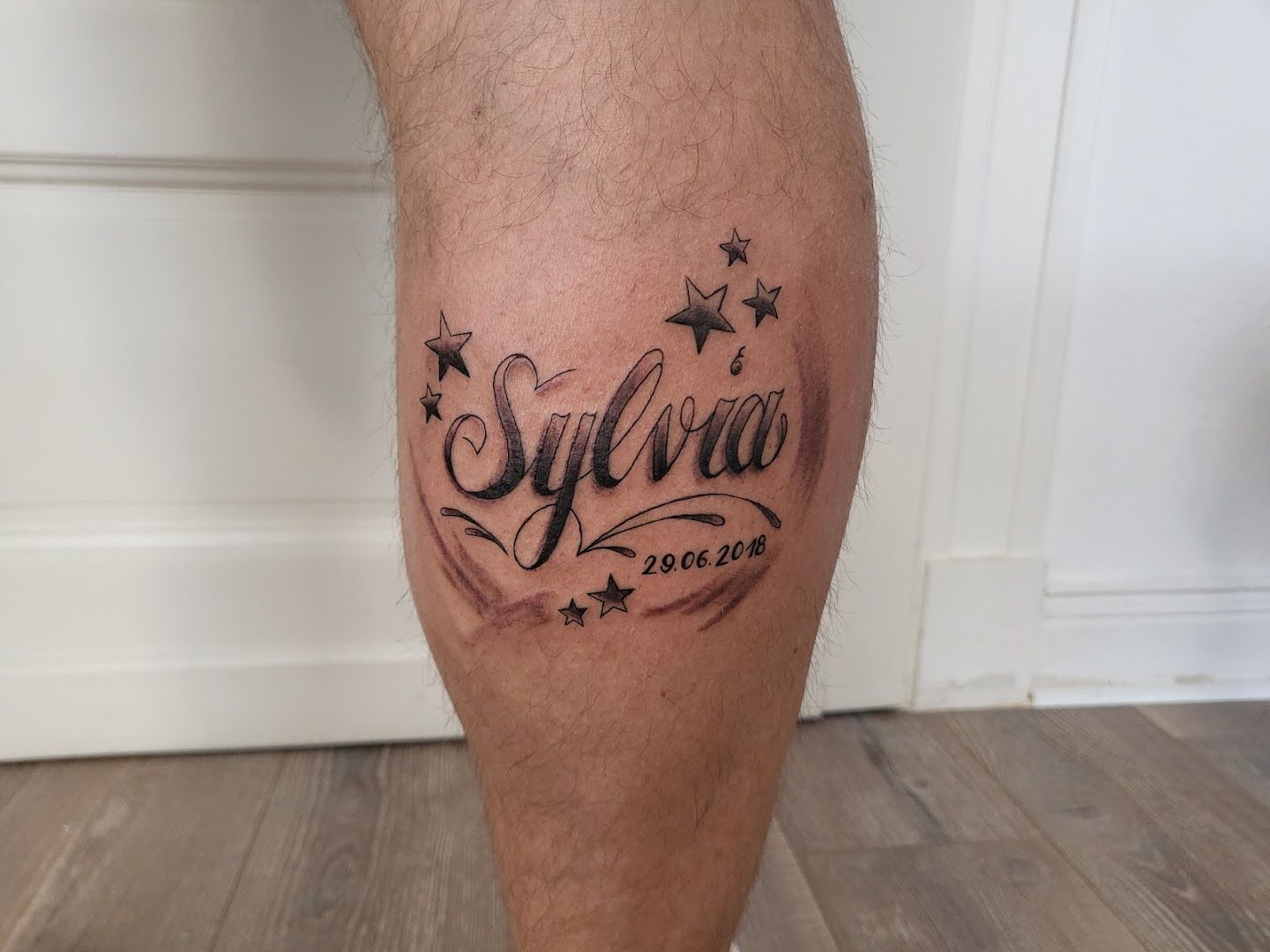 a man's leg with a narben tattoo saying'star ', rheinisch-bergischer kreis, germany