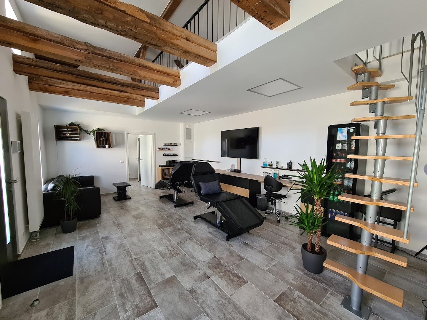 a room with a wooden floor and stairs