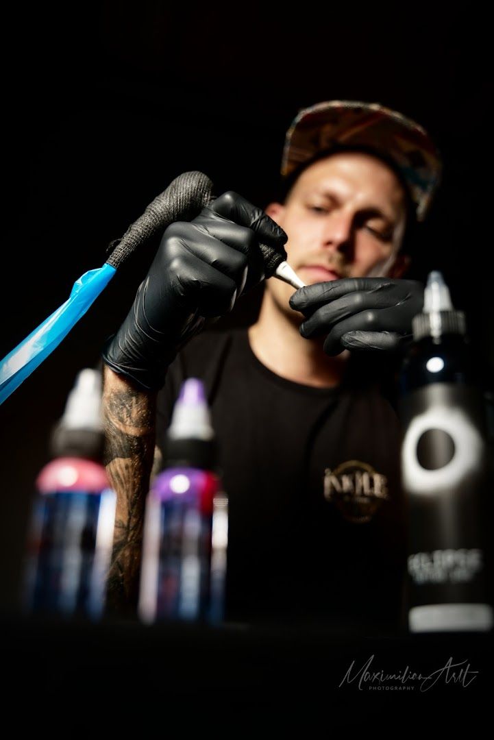 a man with narben tattoos on his arm and hands, ostallgäu, germany