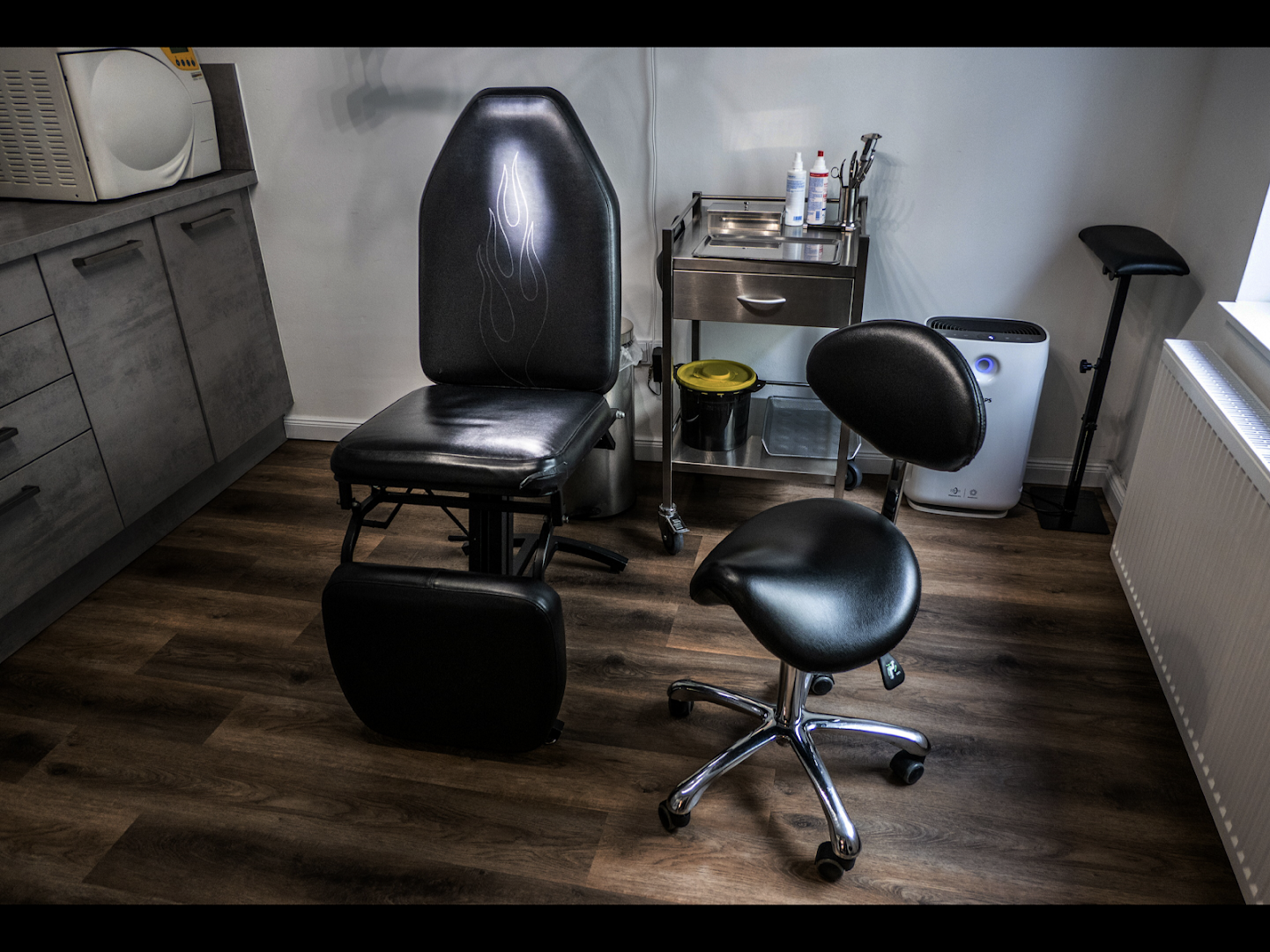 a chair and a stool in a room