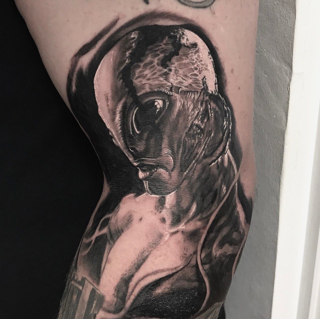 a black and white cover-up tattoo of a man's face, coesfeld, germany