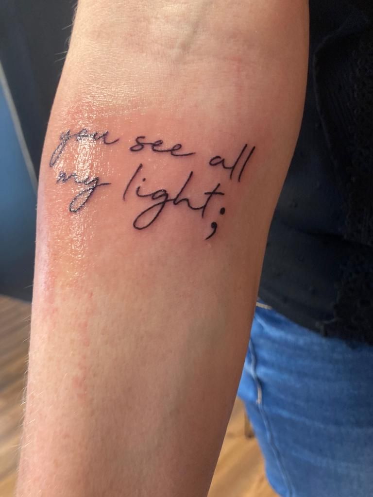 a narben tattoo with the words'love is all right ', bielefeld, germany