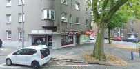 a street with cars parked on the side of it