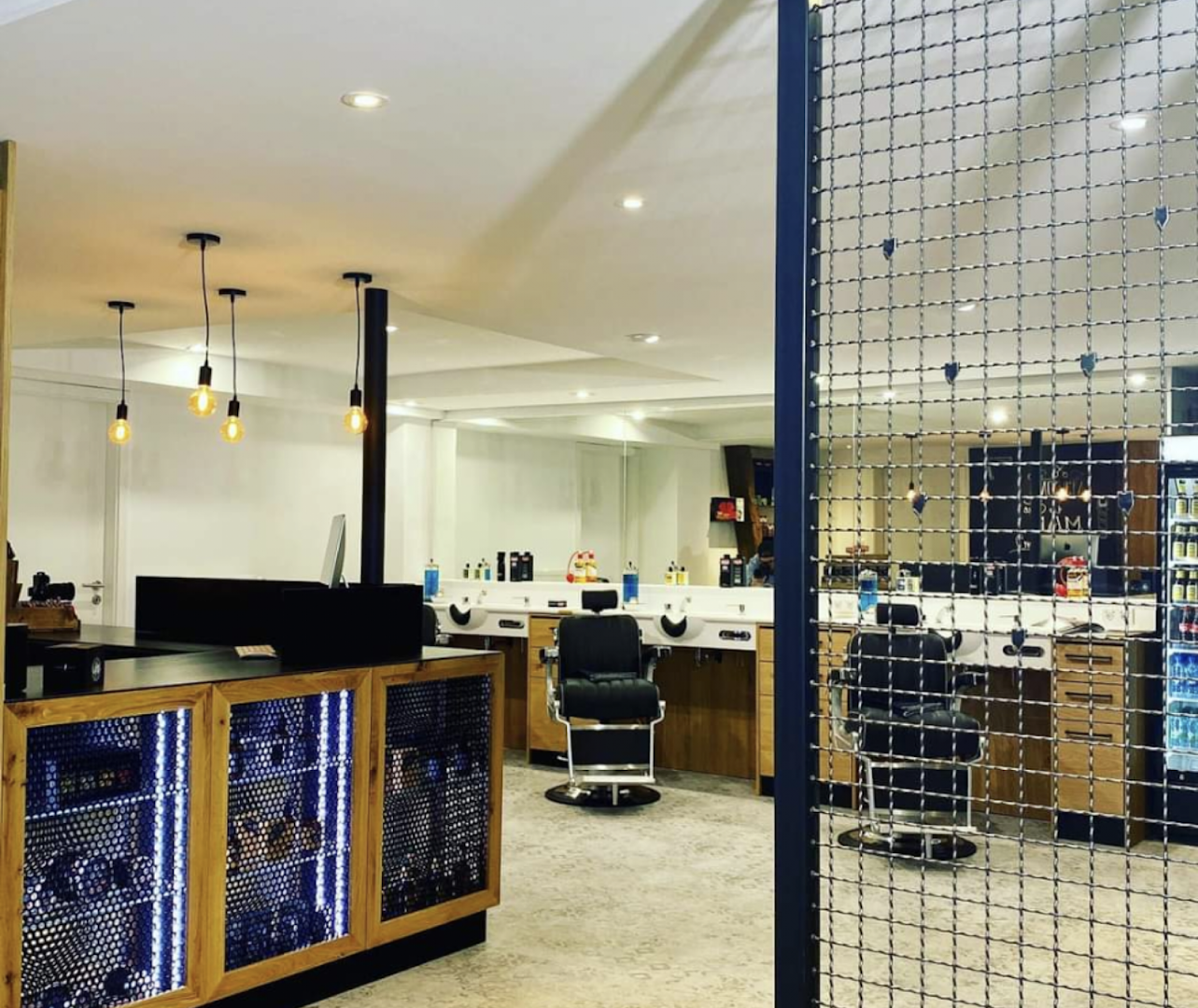 a room with a large glass door and a desk