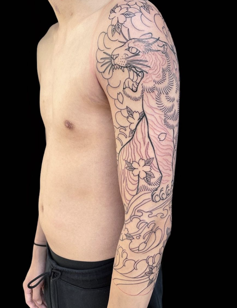 a man with a cover-up tattoo on his arm, frankfurt, germany