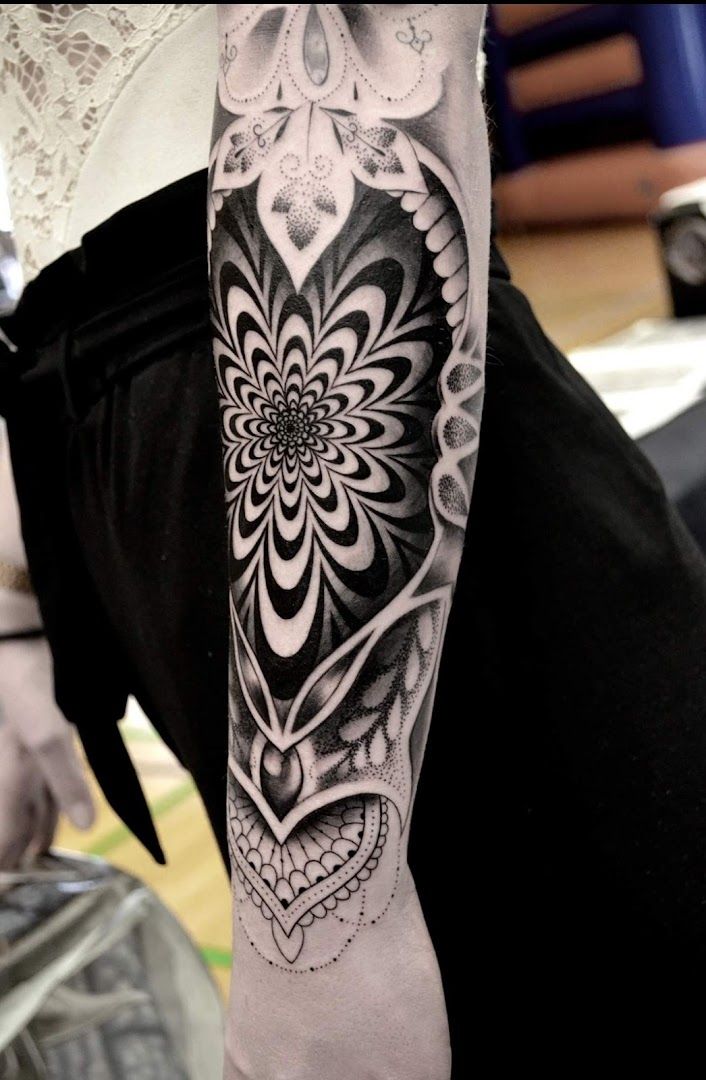 a black and white cover-up tattoo design on the arm, aichach-friedberg, germany