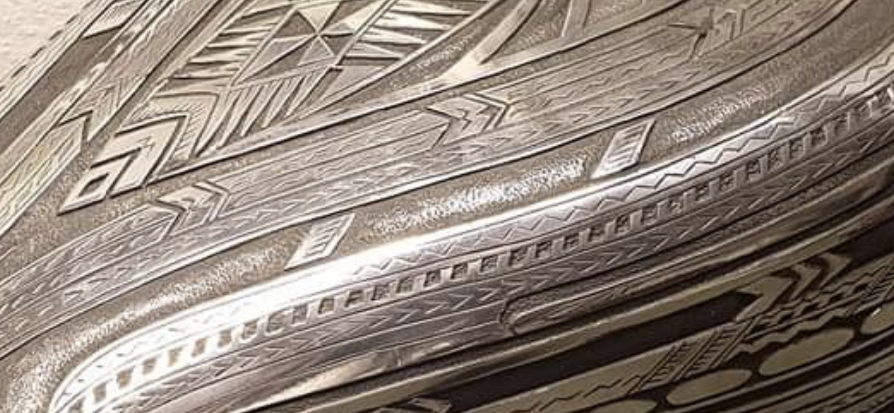 a silver box with a pattern on it