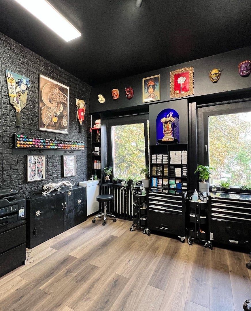 a room with a black brick wall and a black desk