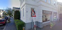 the building is white and has a red sign
