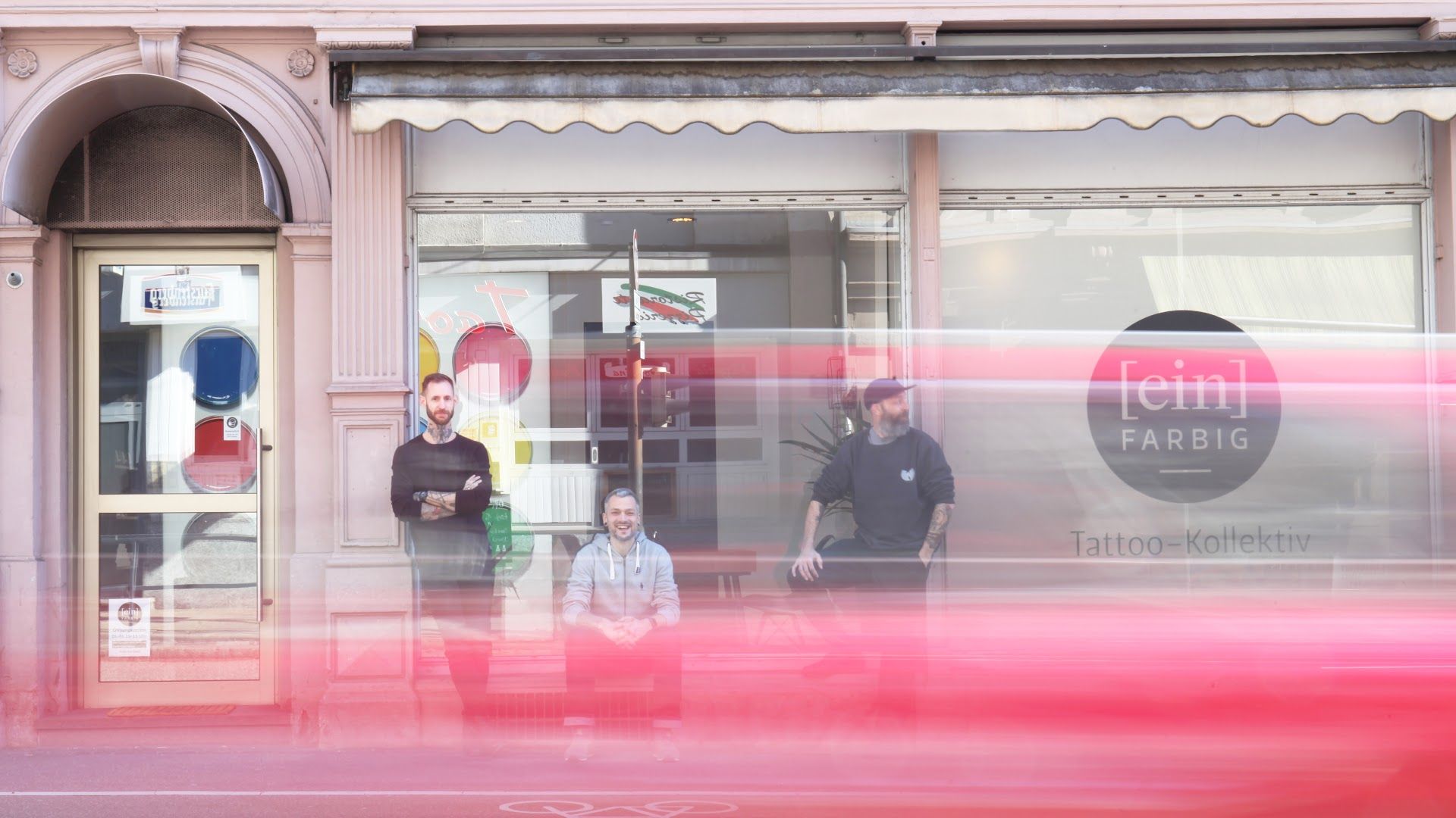 a man and a child are standing in front of a store