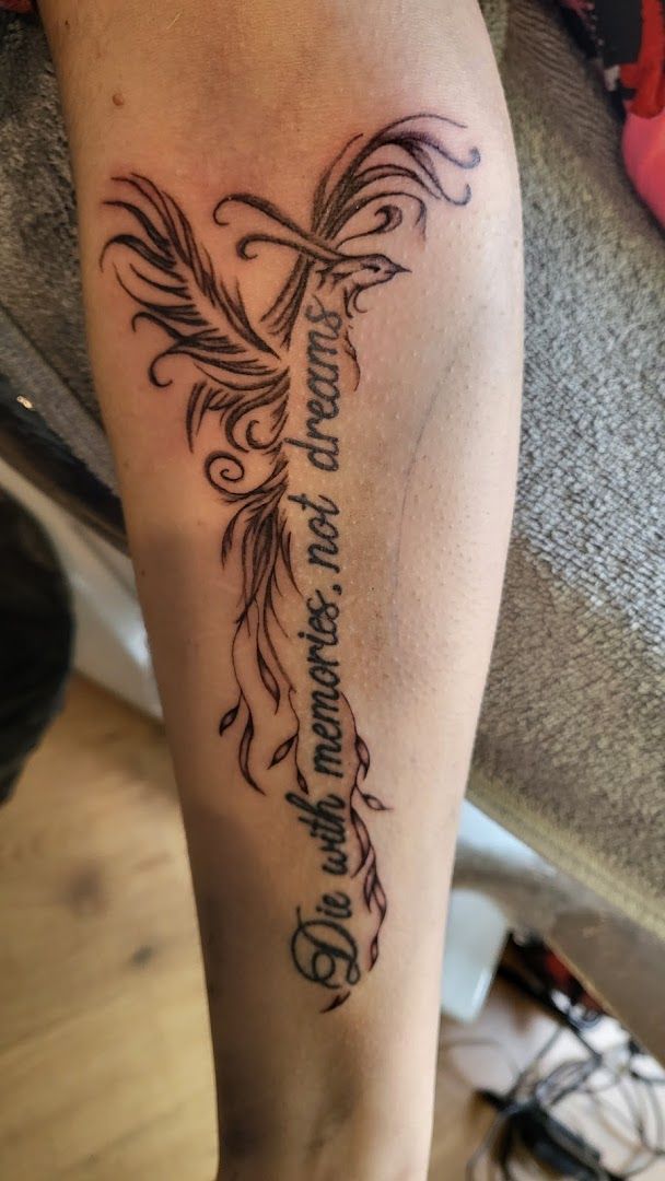 a narben tattoo with a heart and a cross on it, rotenburg (wümme), germany
