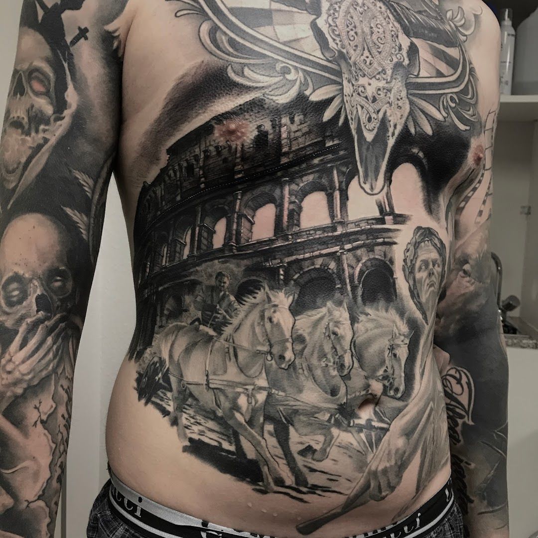 a man with a large cover-up tattoo on his stomach, coesfeld, germany