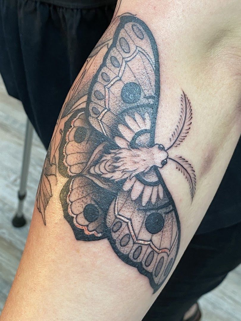 a narben tattoo of a butterfly on the arm, duisburg, germany