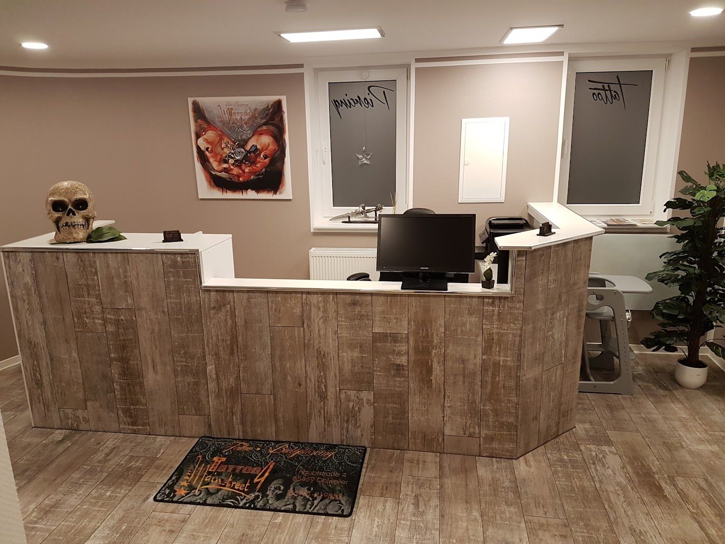 a reception area with a wooden reception desk