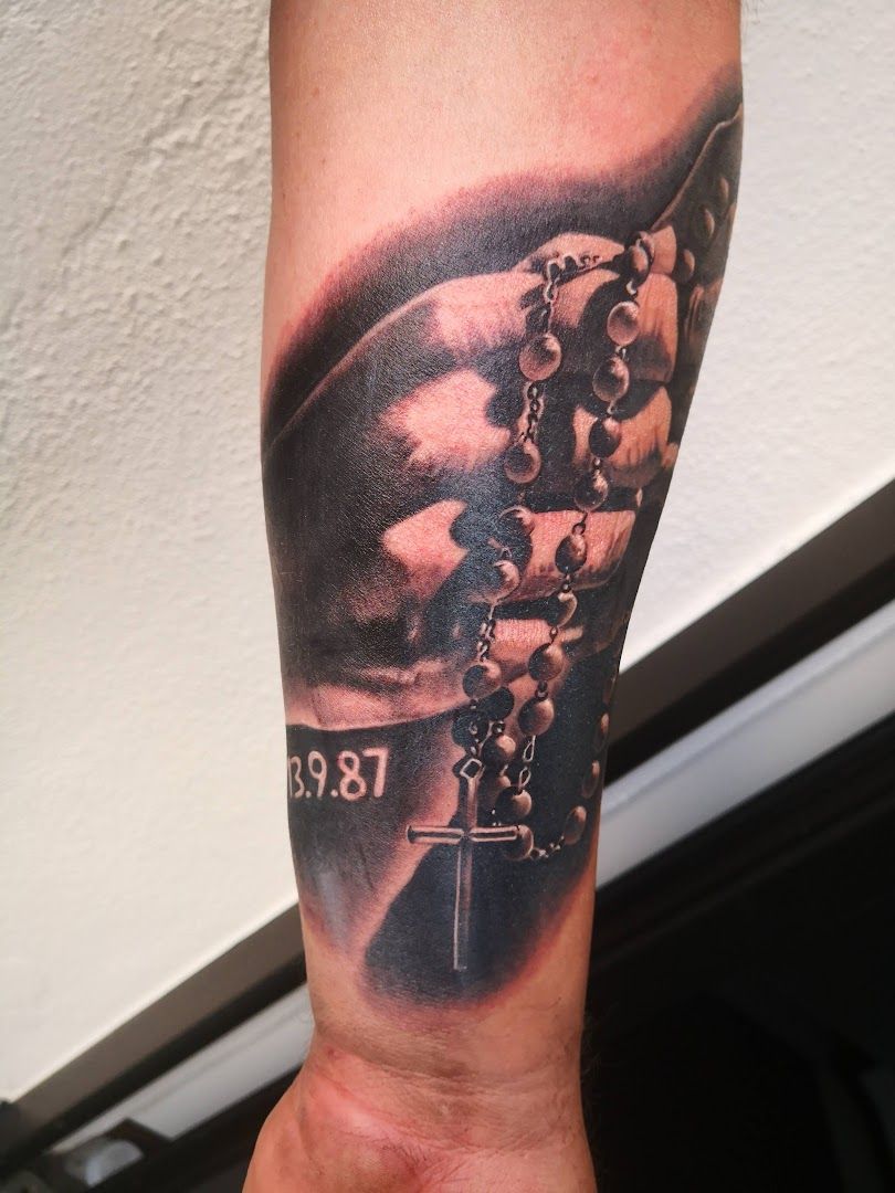 a cover-up tattoo of a man with a clock on his arm, amberg-sulzbach, germany