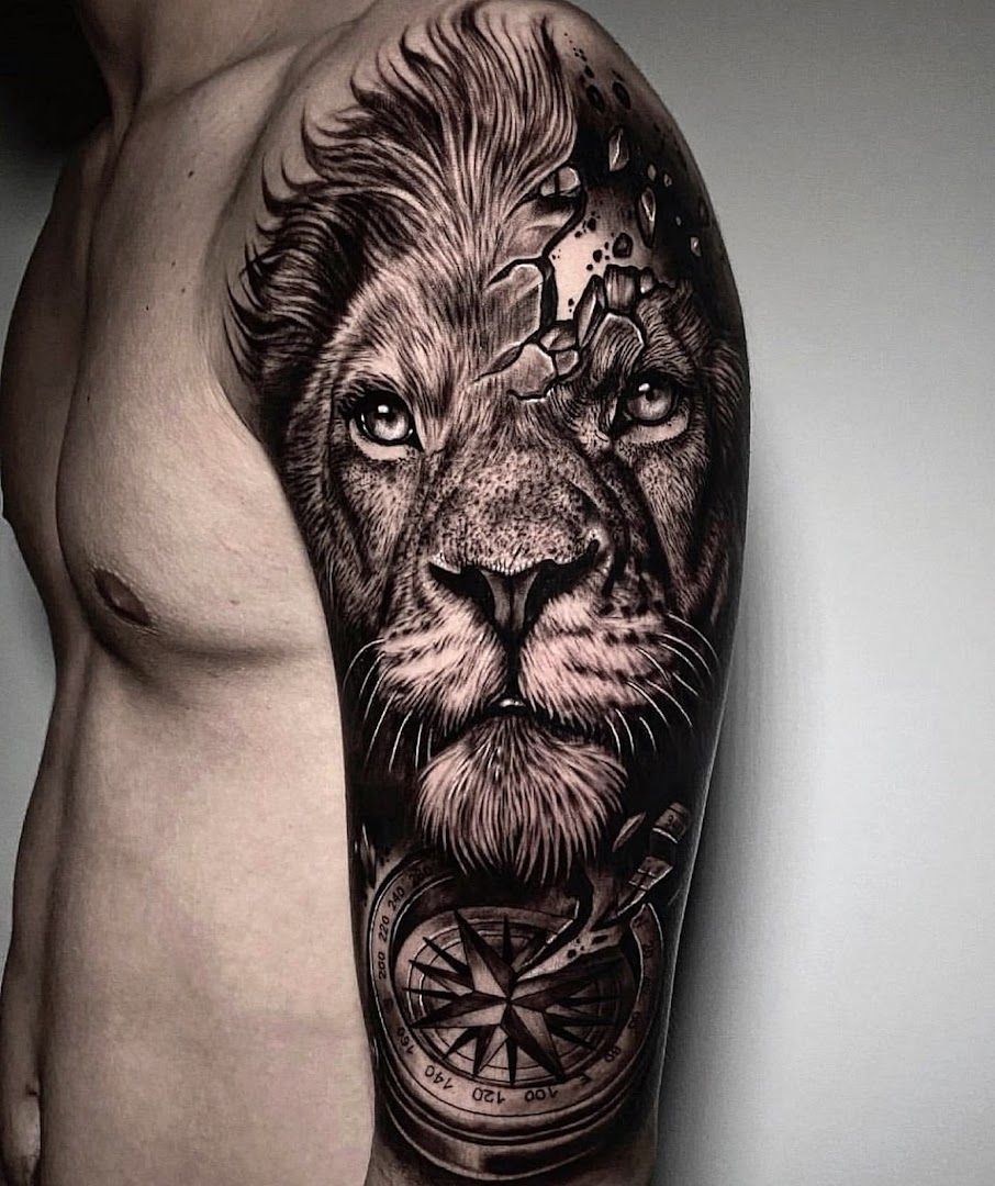 a man with a lion cover-up tattoo on his arm, kreisfreie stadt augsburg, germany