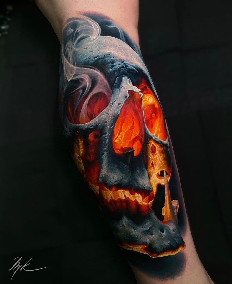 a skull with a burning skull on the arm