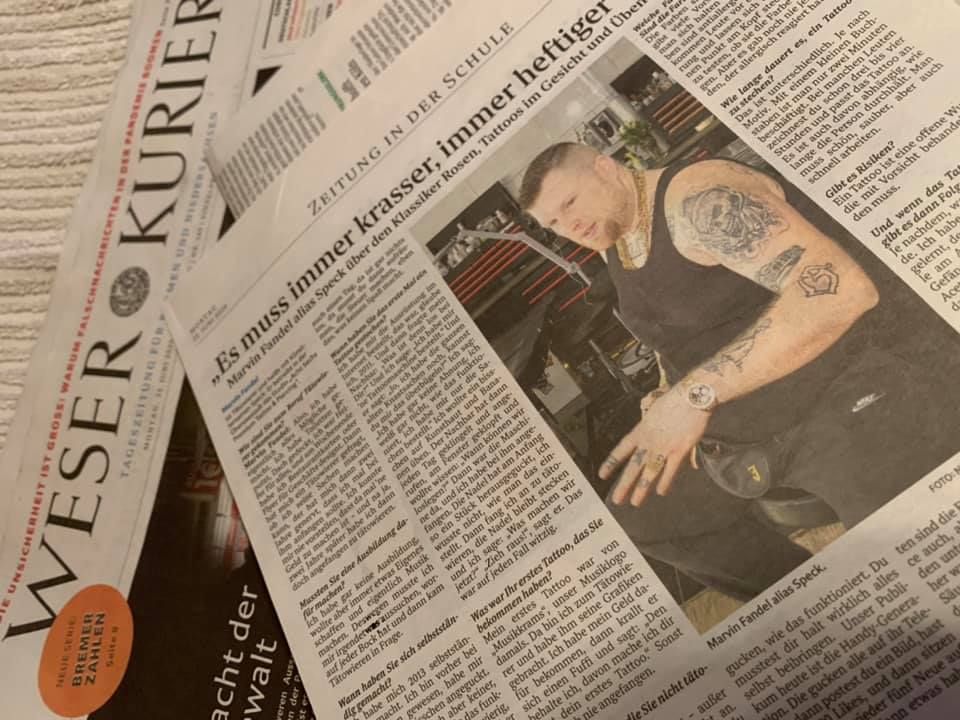 a newspaper with a photo of a man with narben tattoos on it, bremen, germany