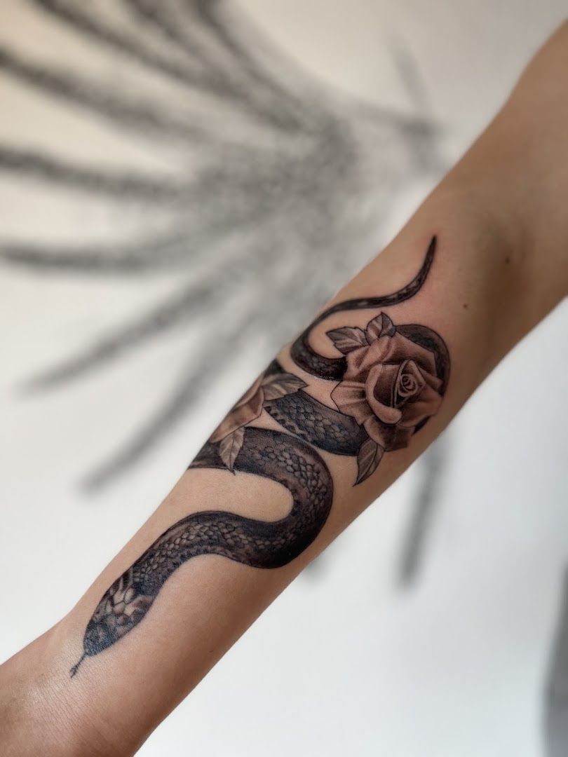 a black and white cover-up tattoo design on the wrist, offenbach, germany