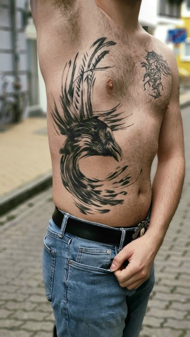 a man with a narben tattoo on his chest, kreisfreie stadt rostock, germany