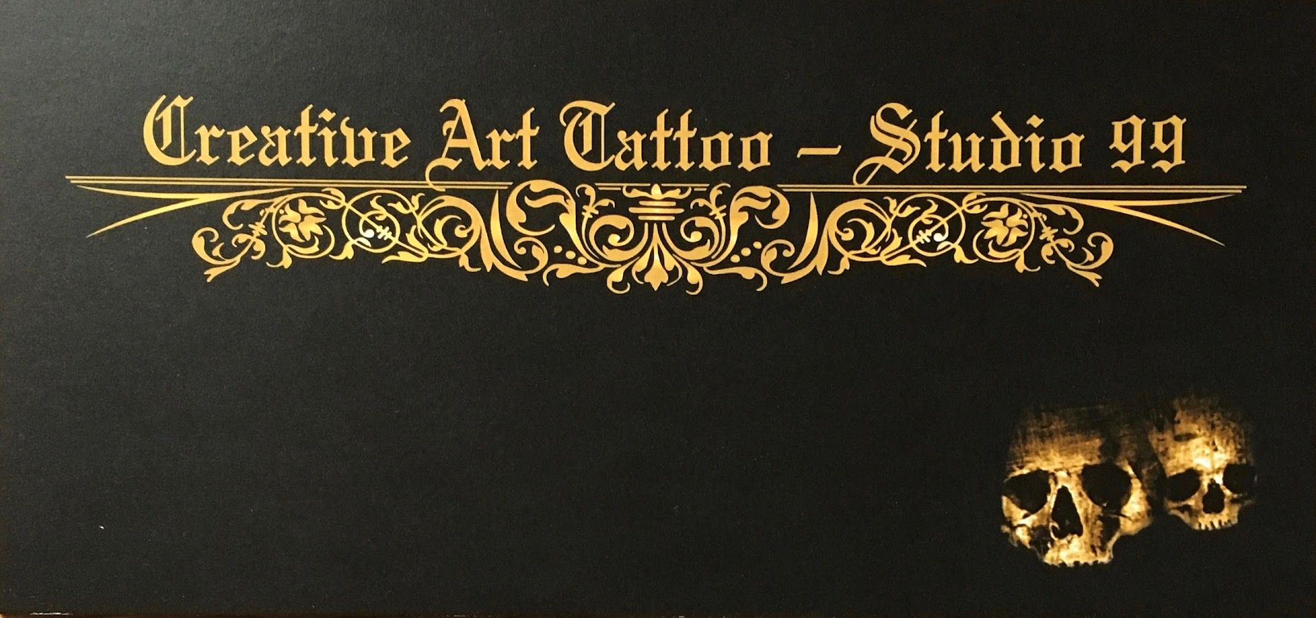 a black and gold album with a skull on it