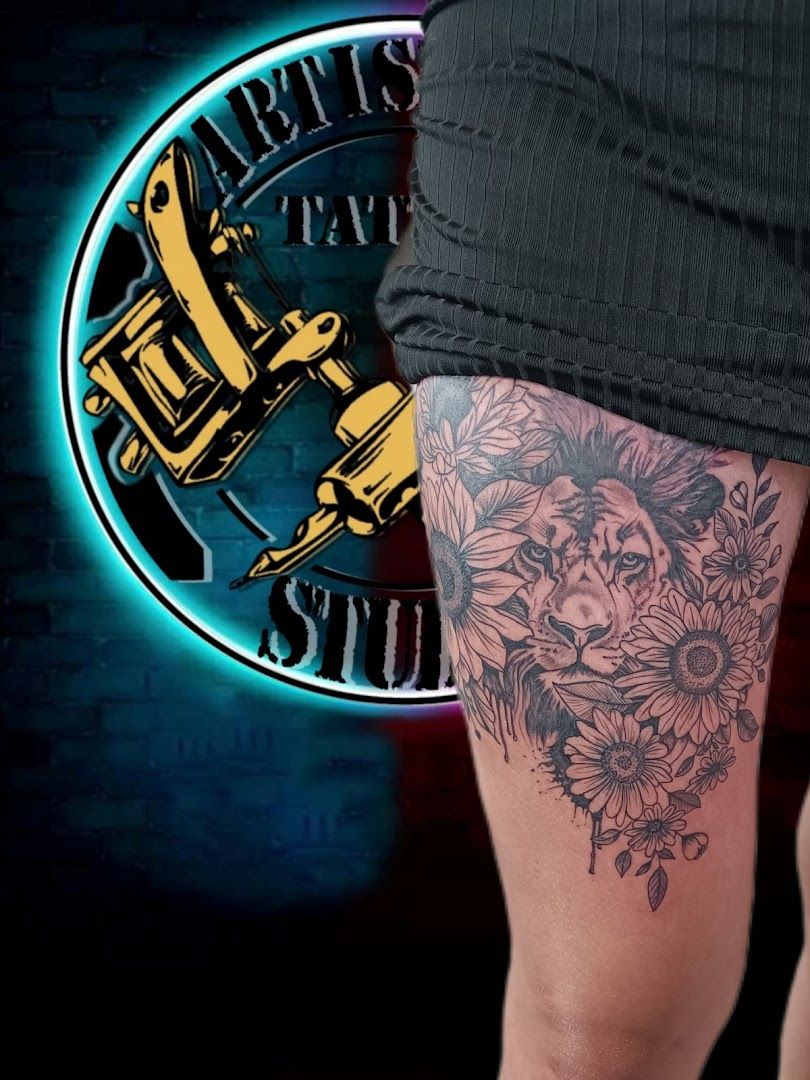 a narben tattoo of a lion with flowers on the leg, bayreuth, germany