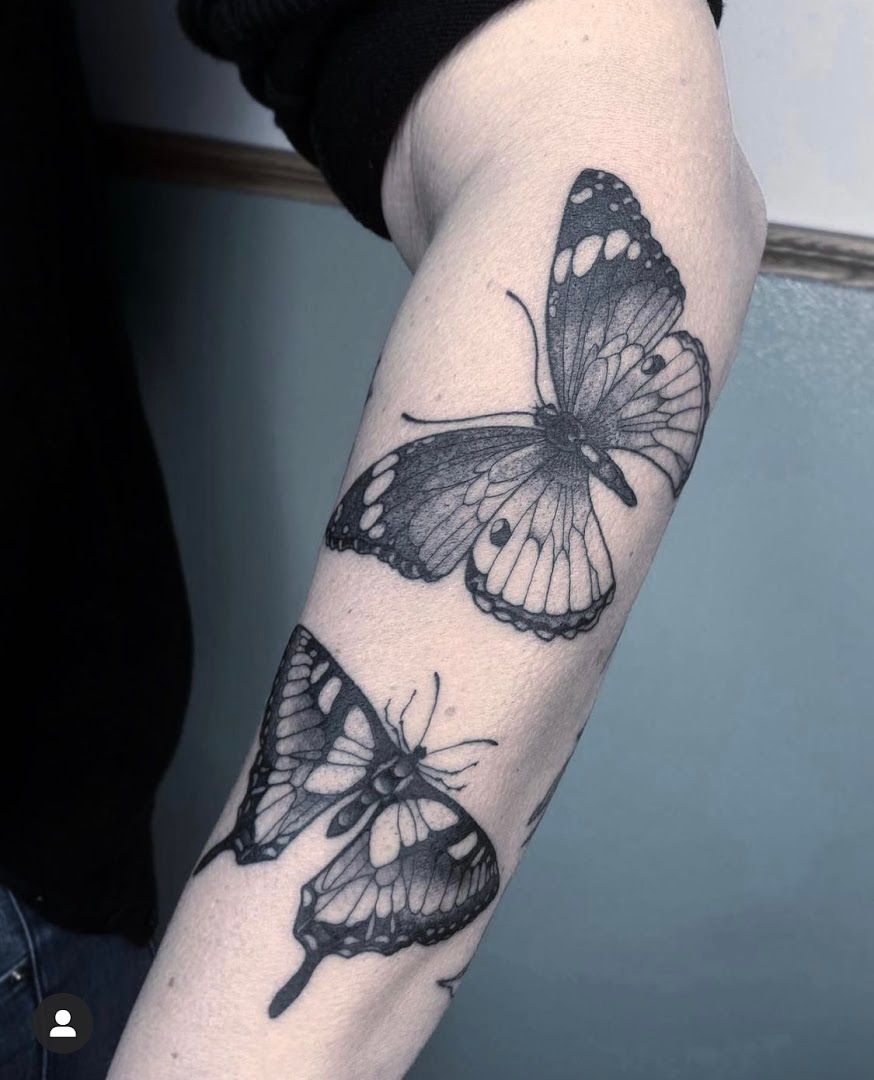 a black and white butterfly realistic tattoos on the arm, marburg-biedenkopf, germany