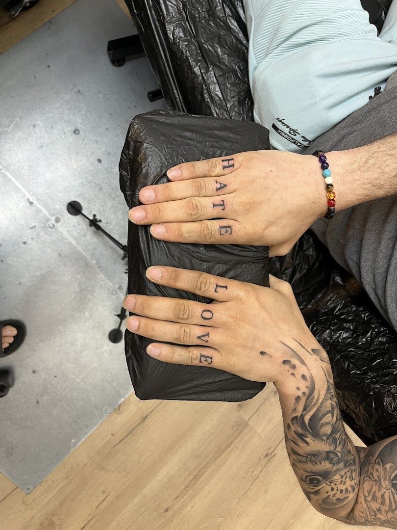 a man with narben tattoos on his hands and a bag, rems-murr, germany