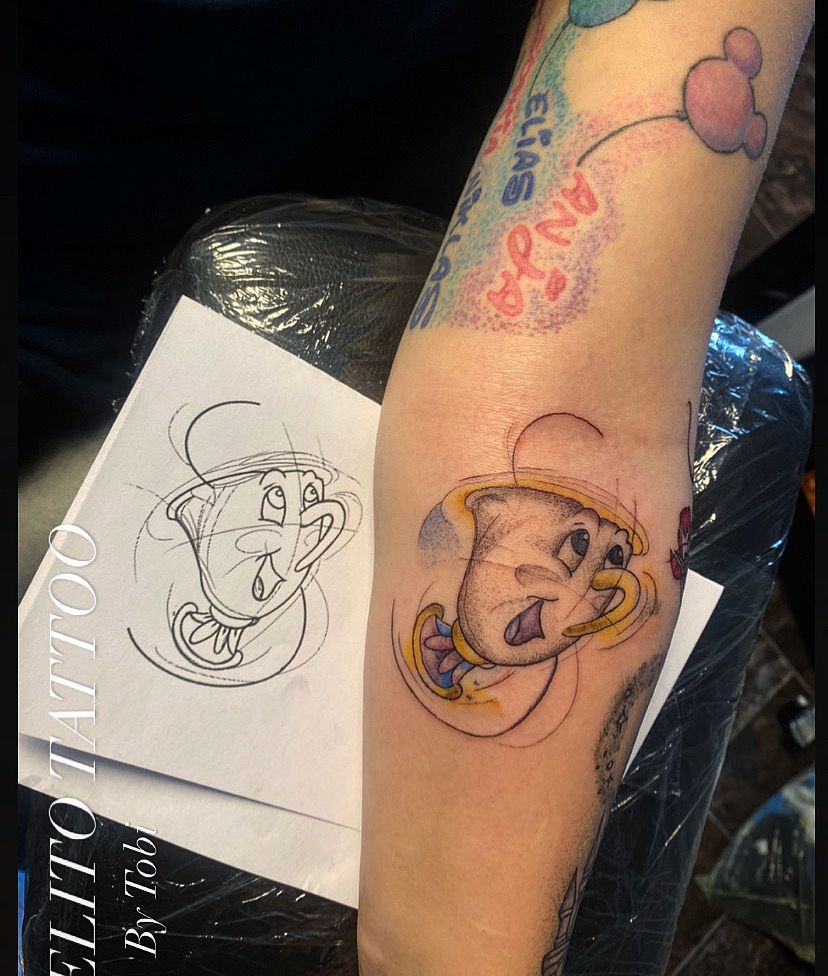 a cover-up tattoo with a drawing of a cat and a balloon, aichach-friedberg, germany