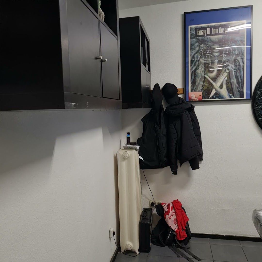 a coat rack in a room with a coat rack