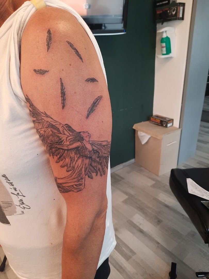 a man with a cover-up tattoo on his arm, neumarkt, germany