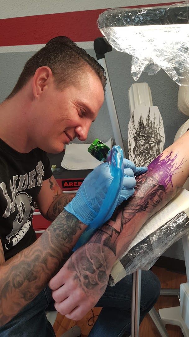 a man with cover-up tattoos on his arm, uckermark, germany