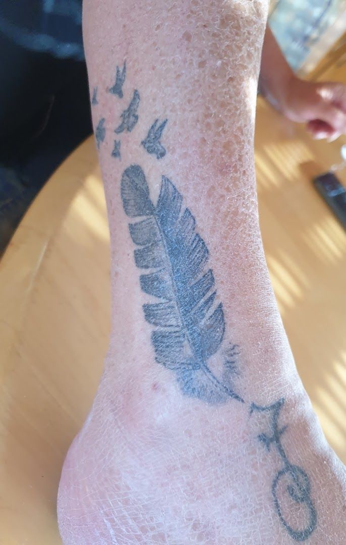 a cover-up tattoo on the foot of a man, reutlingen, germany