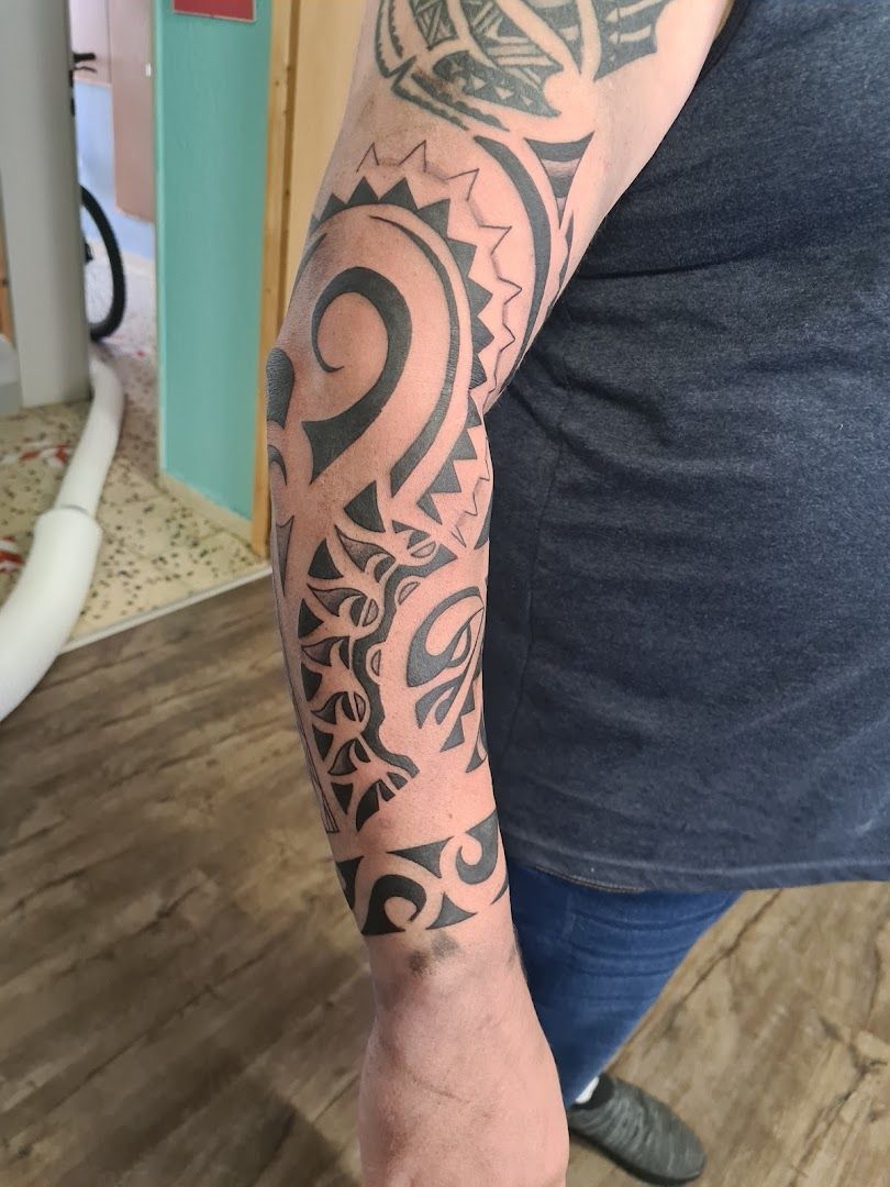 a man with a cover-up tattoo on his arm, neustadt (aisch)-bad windsheim, germany