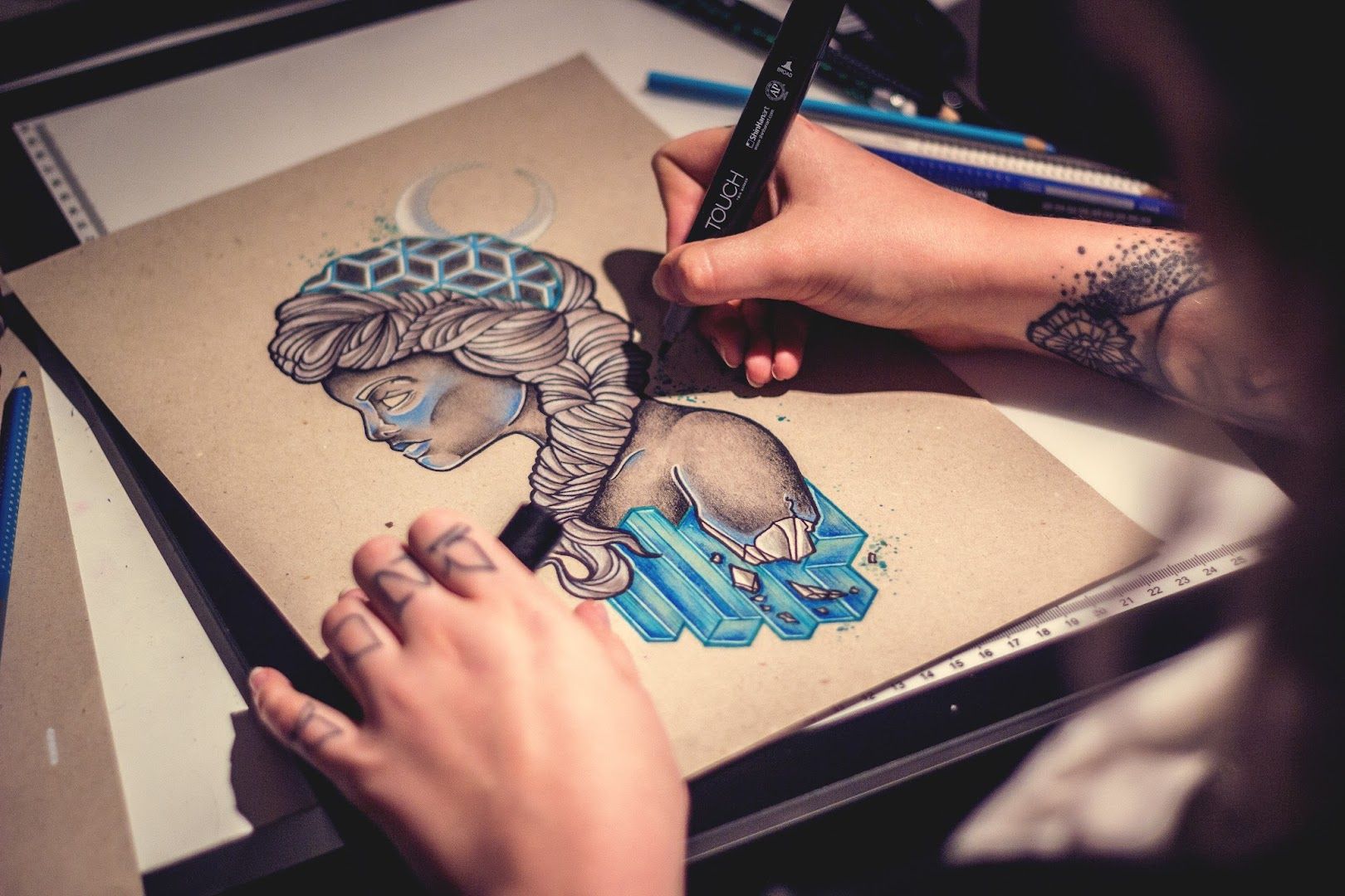 a person drawing a picture on a piece of paper