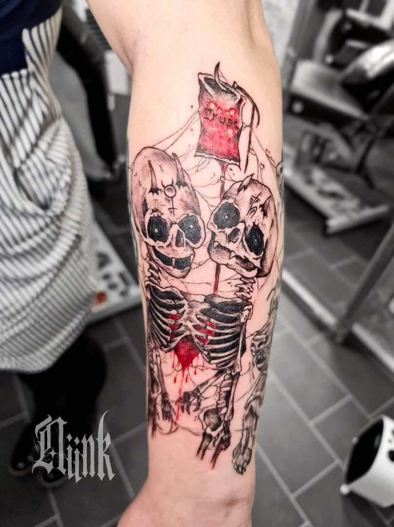 a cover-up tattoo of a skeleton with a red rose on his arm, kulmbach, germany