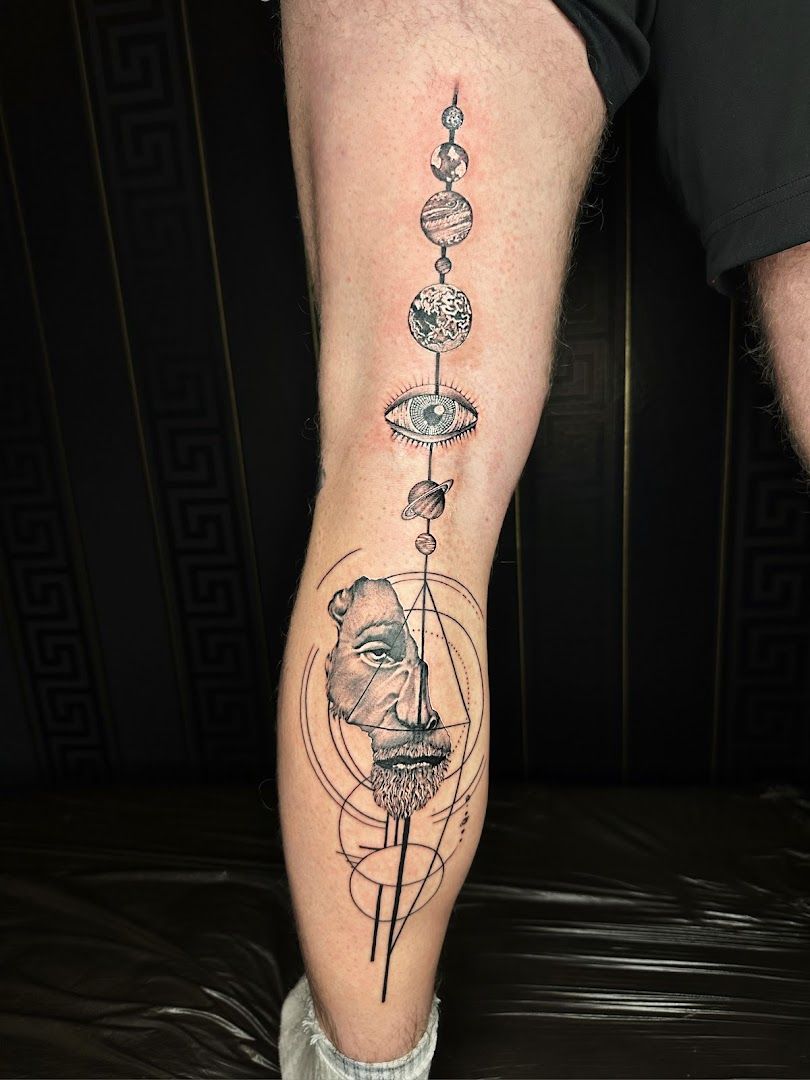 a man's leg with a narben tattoo of a bird and a flower, kreisfreie stadt wolfsburg, germany