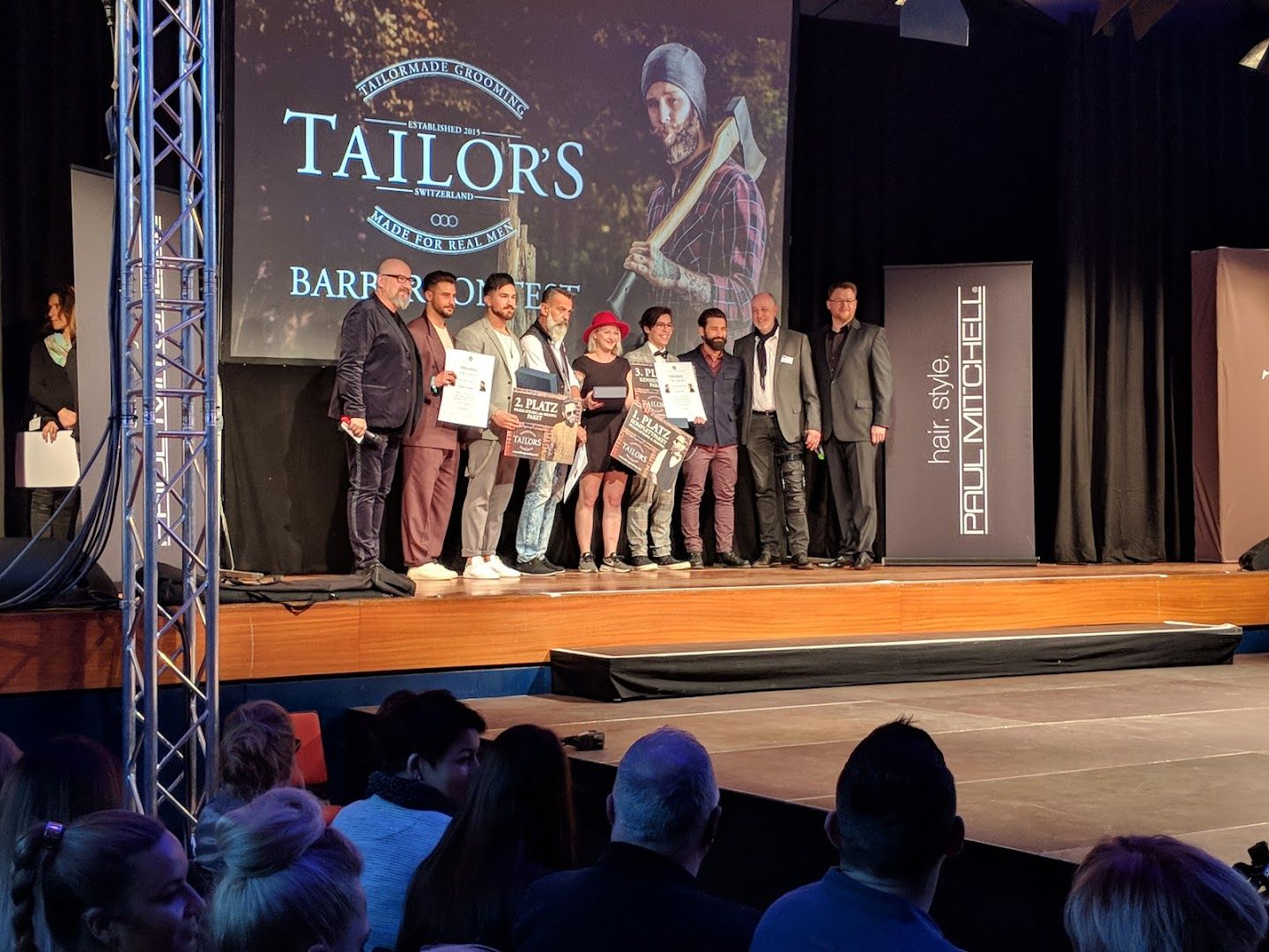 a group of people standing on a stage
