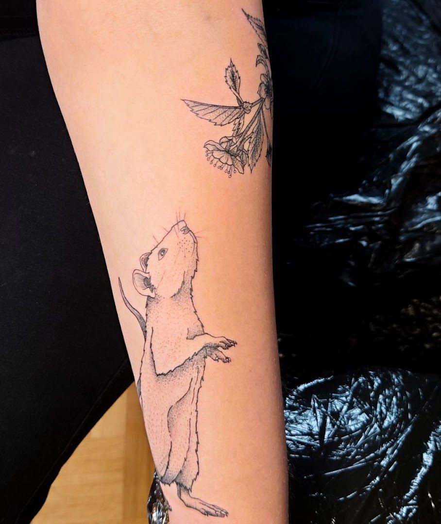 a cover-up tattoo of a mouse and a bird, neuburg-schrobenhausen, germany