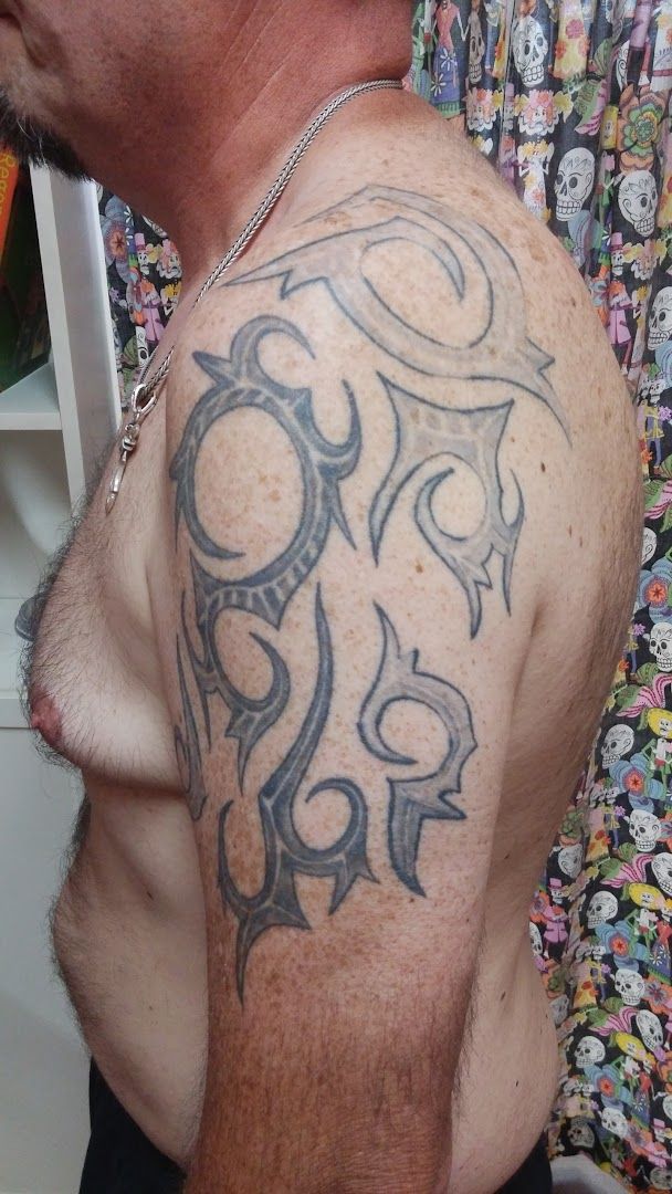 a man with a cover-up tattoo on his shoulder, aschaffenburg, germany