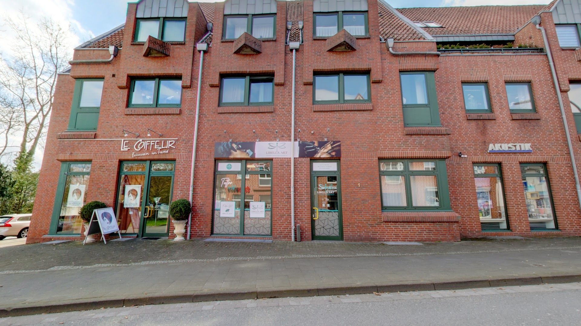 a brick building with a sign on the front