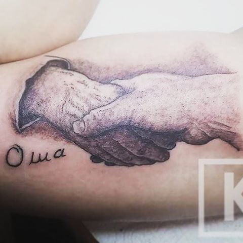 a blackwork tattoo of a dog and a hand, odenwaldkreis, germany