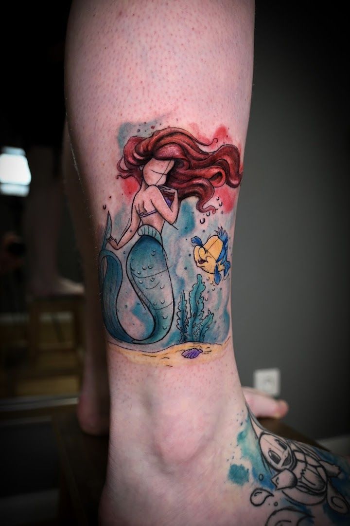 a portrait tattoos of a mermaid and a fish, paderborn, germany