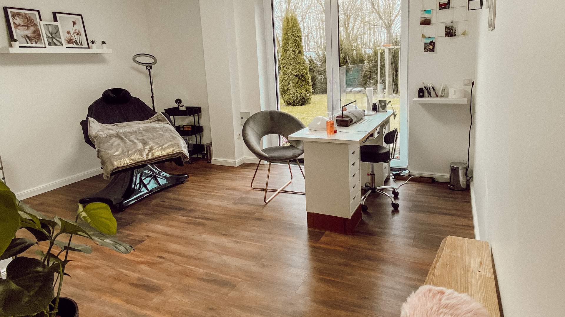 a room with a desk, chair, and a window