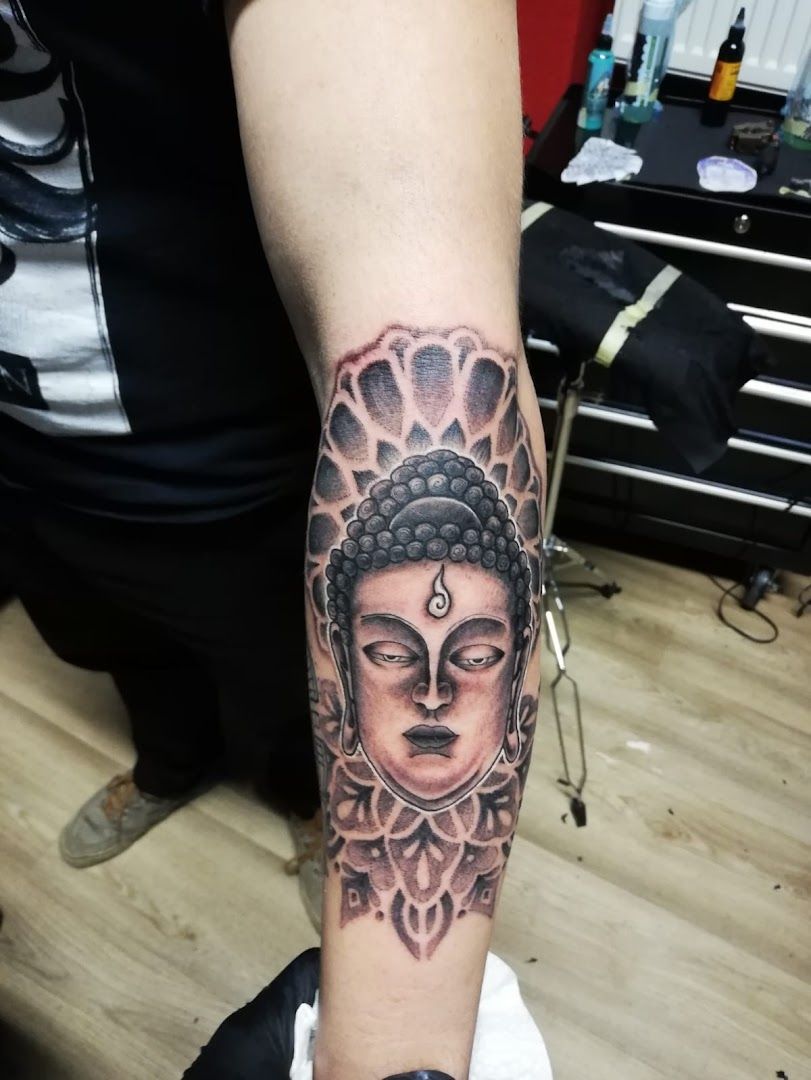 a narben tattoo of a buddha head on the forearm, kreisfreie stadt augsburg, germany
