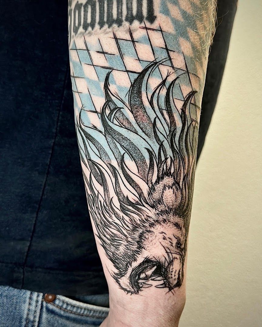 a narben tattoo of a dragon with a geometric pattern on the arm, freising, germany