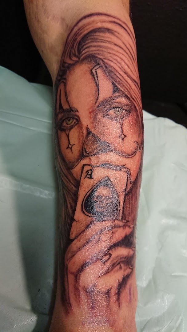 a japanische tattoos in leipzig of a woman with a bird on her arm, neumarkt, germany