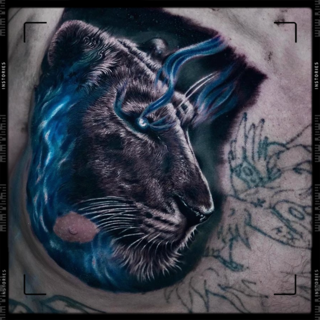 a portrait tattoos of a tiger with blue eyes, wesel, germany